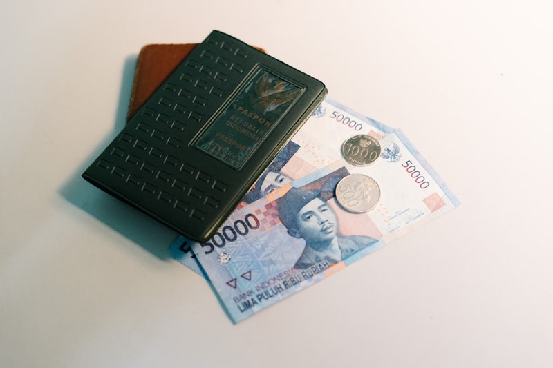 Banknotes and passport laid out on a desk